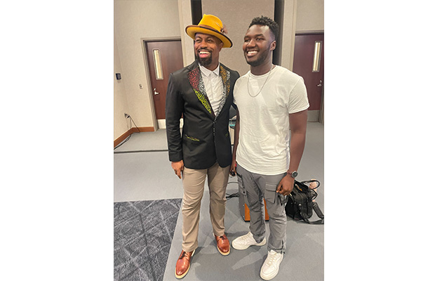 Justin jones taking a picture with someone